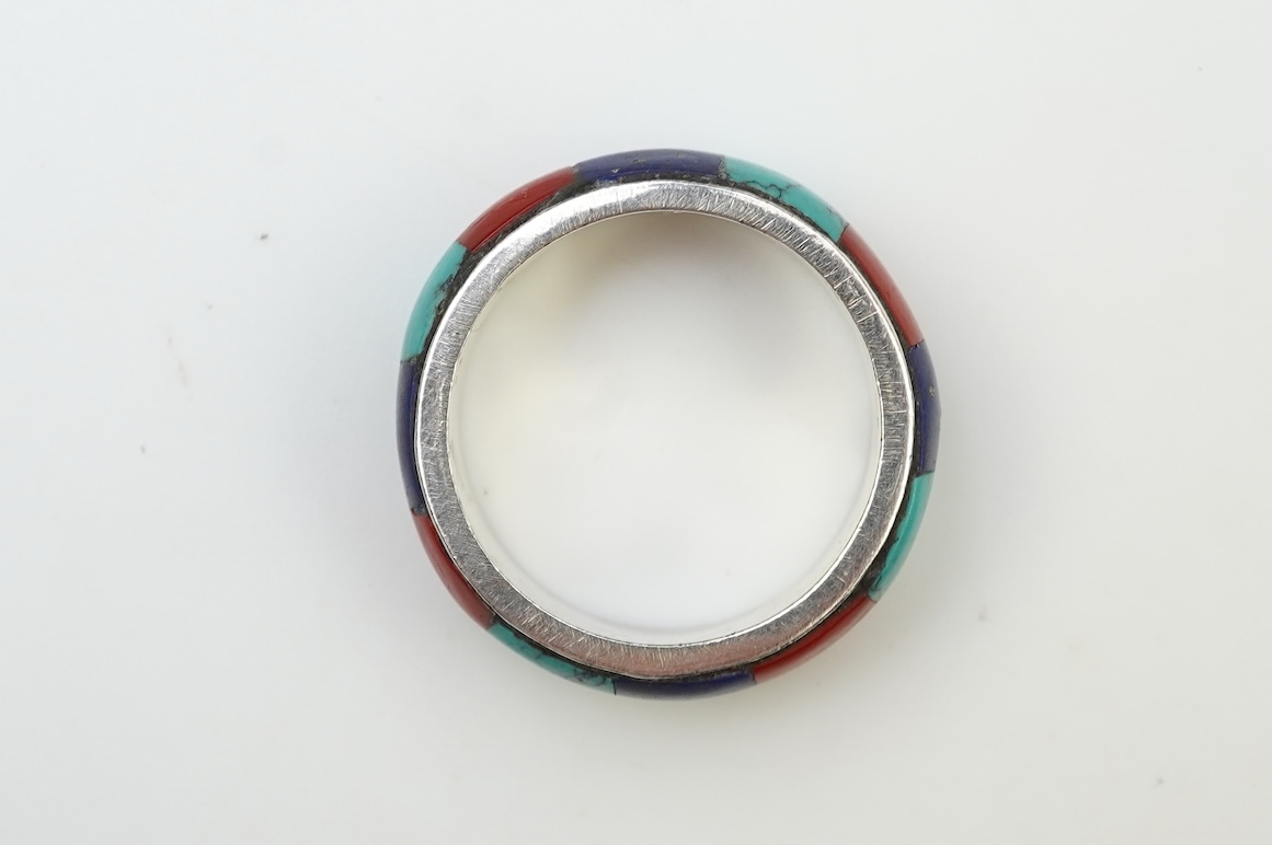 A collection of silver jewellery including a Zuni bangle